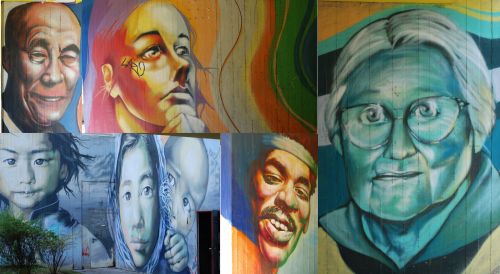 A collage of people's faces of many different ages, genders, and races, painted on walls in rainbow colors.